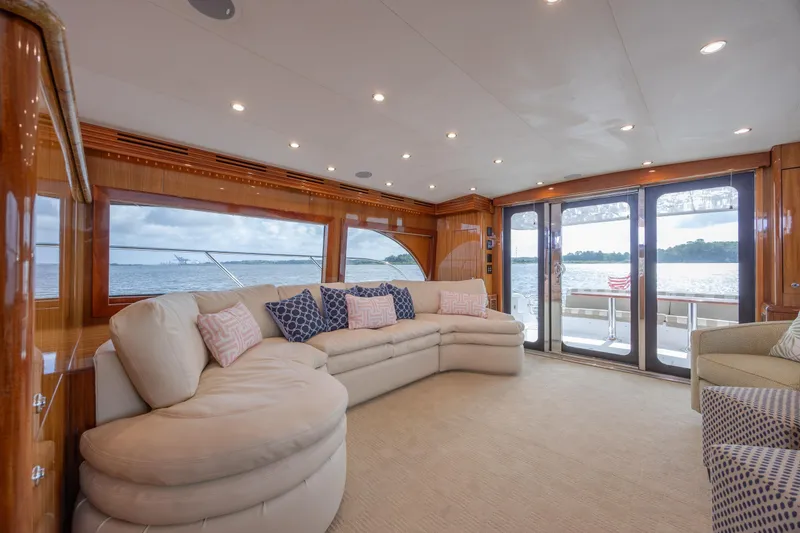 Slide: The Image of Luxurious interior of 2008 Hatteras 64 Motor Yacht with plush seating and scenic windows. - 44