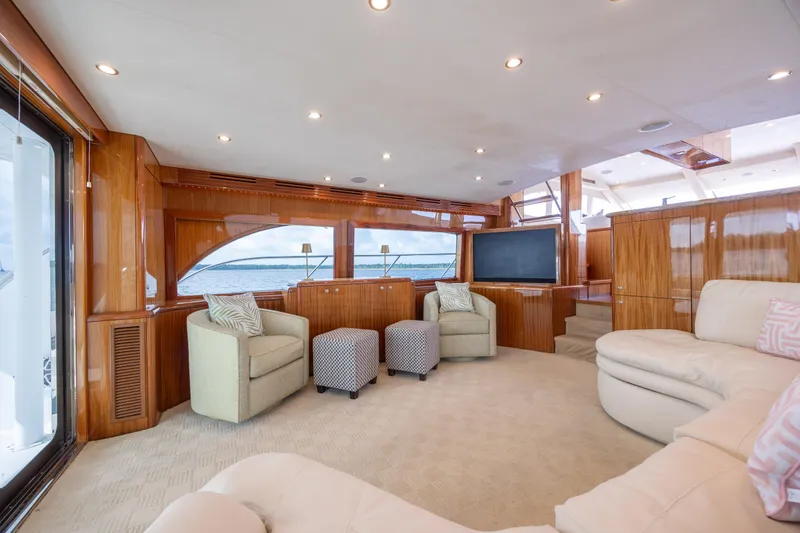 Slide: The Image of Luxurious interior of 2008 Hatteras 64 Motor Yacht with elegant seating and large windows. - 46