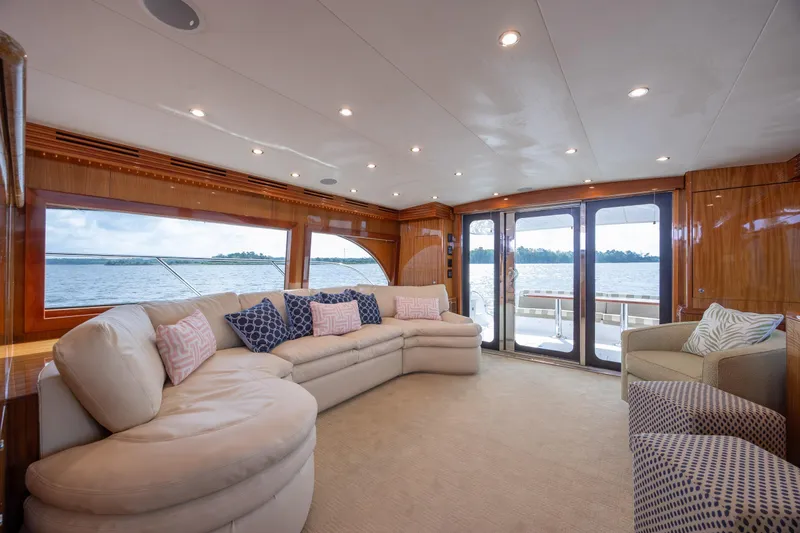 Slide: The Image of Luxurious interior of 2008 Hatteras 64 Motor Yacht with plush seating and scenic views. - 47