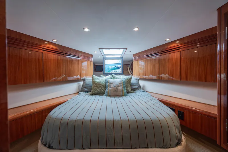 Slide: The Image of Luxurious bedroom interior of 2008 Hatteras 64 Motor Yacht with elegant wood finishes. - 52