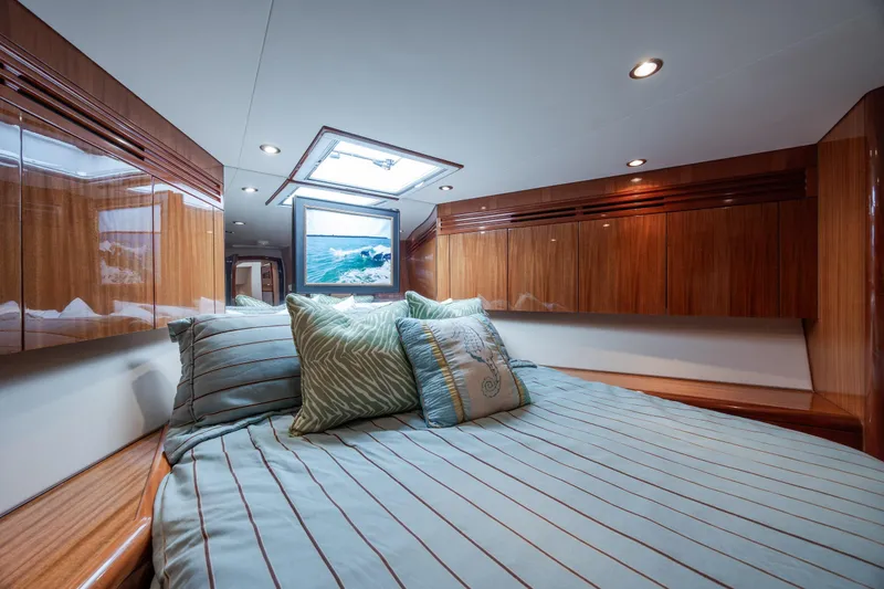 Slide: The Image of Luxurious bedroom interior of 2008 Hatteras 64 Motor Yacht with elegant wood finishes. - 53