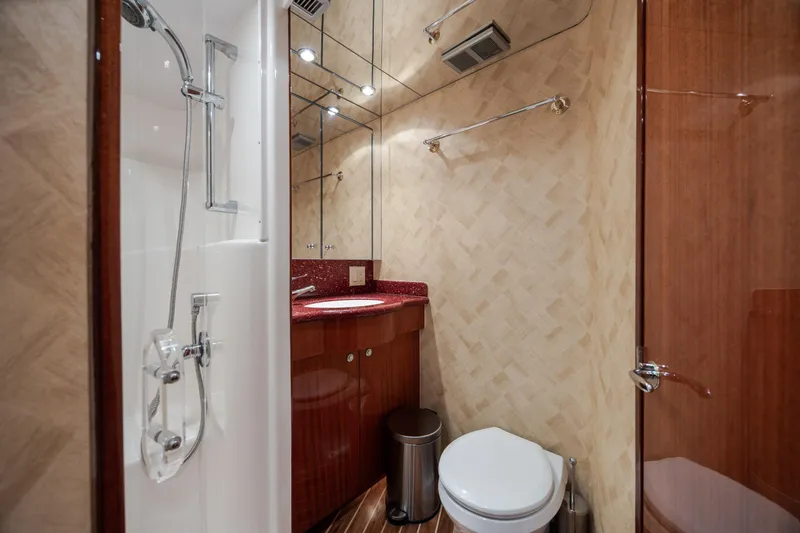 Slide: The Image of Luxurious bathroom in 2008 Hatteras 64 Motor Yacht with shower and elegant wood finishes. - 63