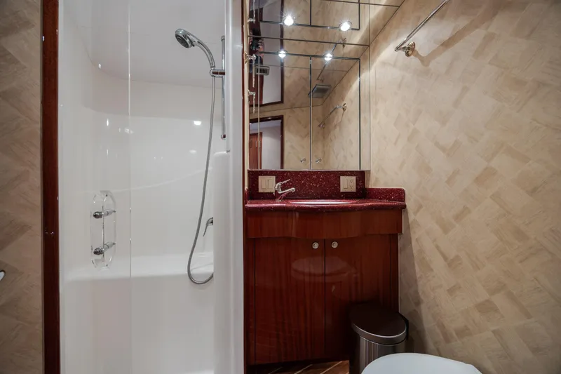 Slide: The Image of Luxurious bathroom in 2008 Hatteras 64 Motor Yacht with shower and vanity. - 64
