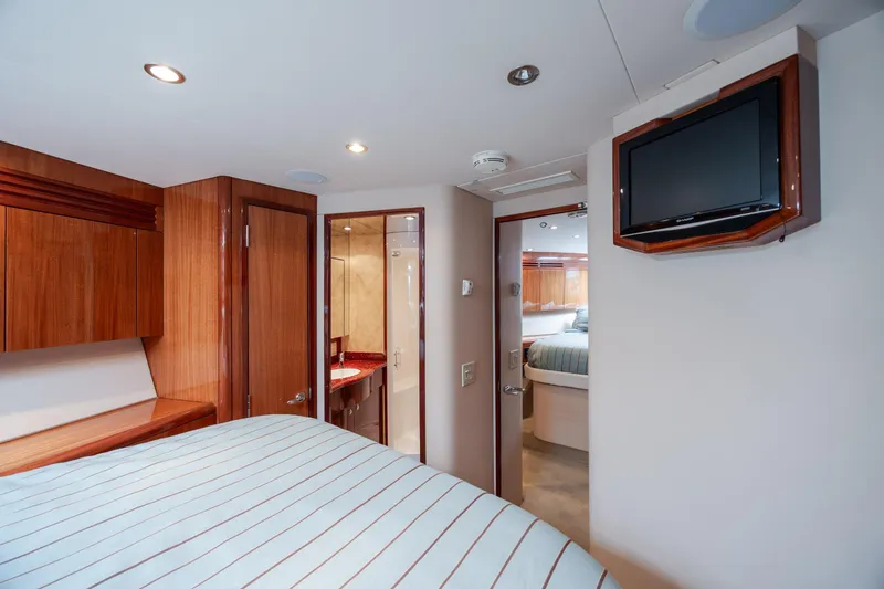 Slide: The Image of Luxurious interior of 2008 Hatteras 64 Motor Yacht with wood finishes and modern amenities. - 66