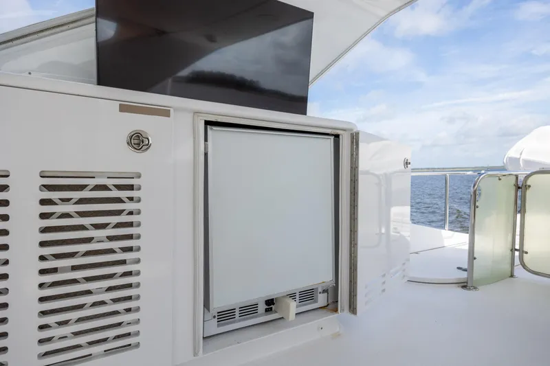 Slide: The Image of Outdoor kitchenette on 2008 Hatteras 64 Motor Yacht with ocean view. - 93