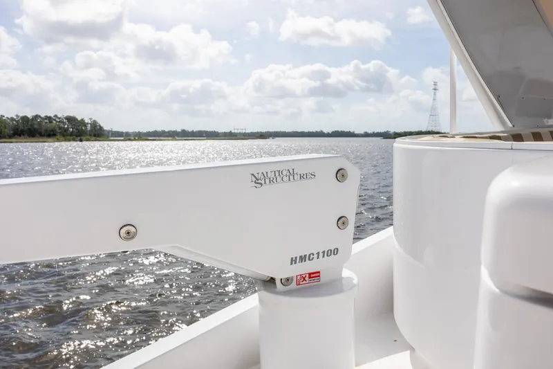 Slide: The Image of Hatteras 64 Motor Yacht 2008, featuring Nautical Structures HMC1100, on a serene waterway. - 95