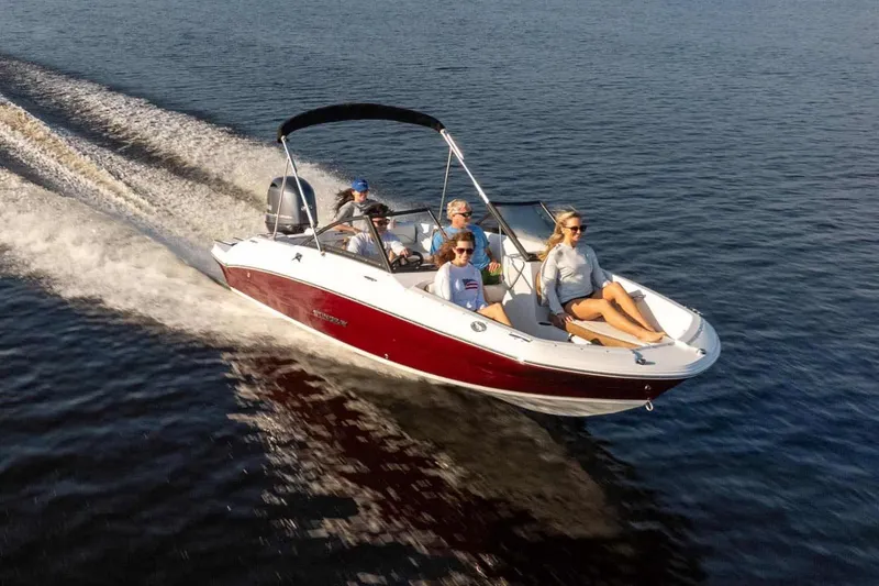 Slide: The Image of 2026 Stingray 191 DC boat cruising with passengers on water. - 17