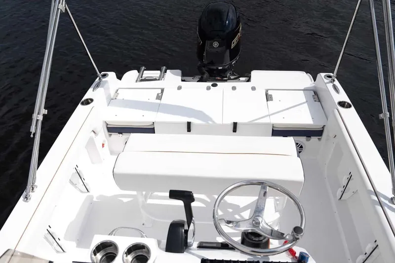 Slide: The Image of Interior view of 2026 Stingray 173 CC boat with steering console. - 6