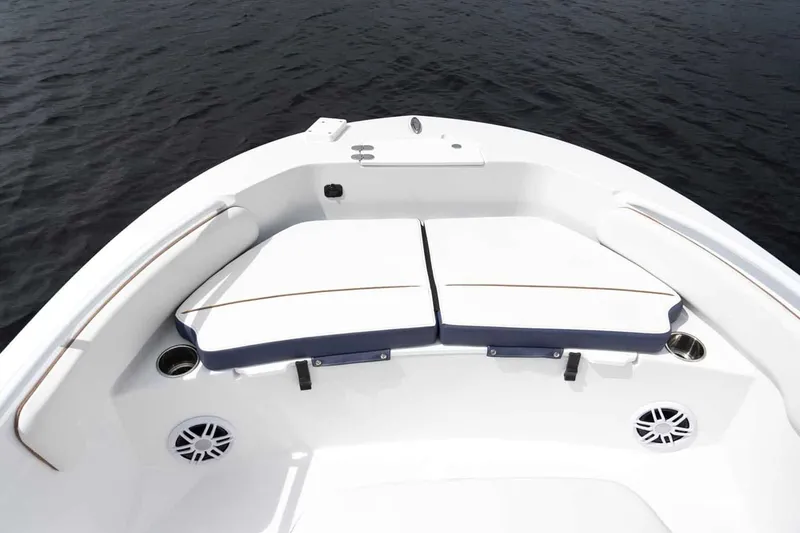 Slide: The Image of Stingray 173 CC 2026 boat with white seating area on calm water. - 7