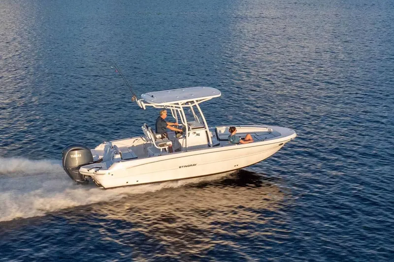 Slide: The Image of 2026 Stingray 236 CC boat cruising on calm water. - 18