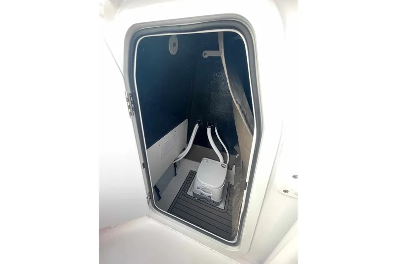 Slide: The Image of Interior of 2026 Stingray 236 CC featuring a toilet. - 8
