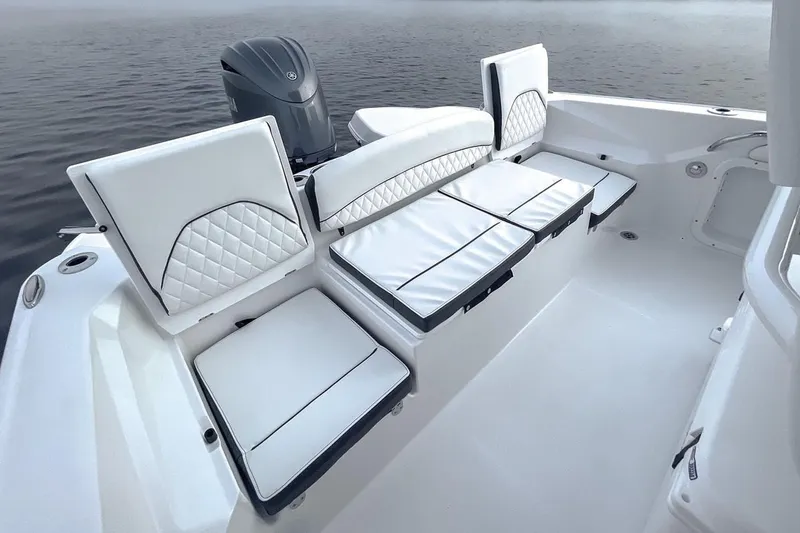 Slide: The Image of Interior view of 2026 Stingray 236 CC boat with white upholstery. - 9
