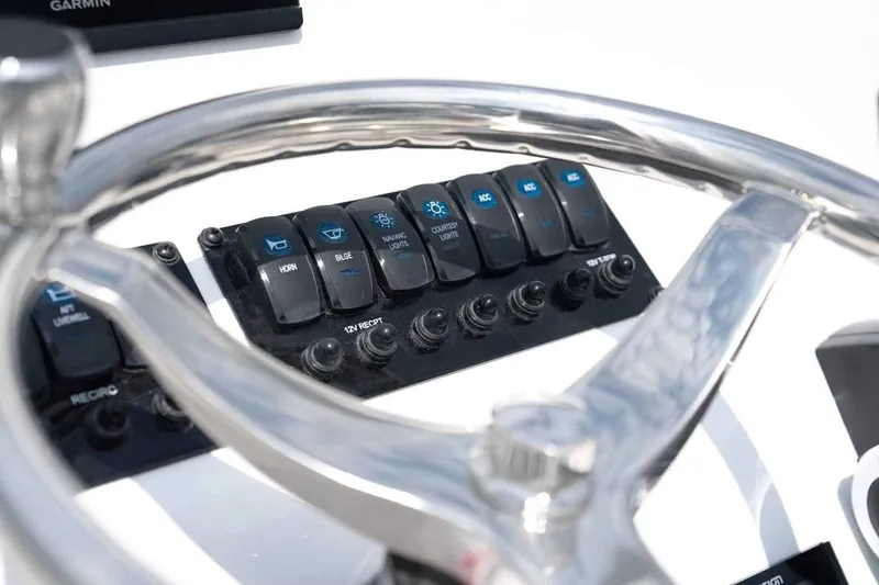 Slide: The Image of Stingray 182 SC 2026 dashboard with switches and steering wheel. - 10