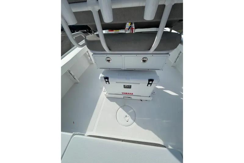 Slide: The Image of 2025 Sea Hunt BX 22 BR boat interior with Yamaha cooler and storage compartments. - 10
