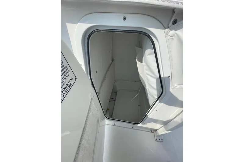 Slide: The Image of 2025 Sea Hunt BX 22 BR boat storage compartment, open hatch view. - 12
