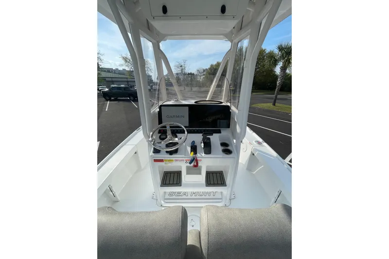 Slide: The Image of 2025 Sea Hunt BX 22 BR boat console with Garmin navigation system and steering wheel. - 9