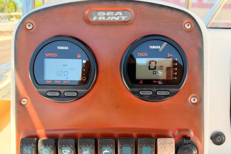 Slide: The Image of Dashboard of a 2010 Sea Hunt Ultra 210 boat with Yamaha speed and tachometer gauges. - 20
