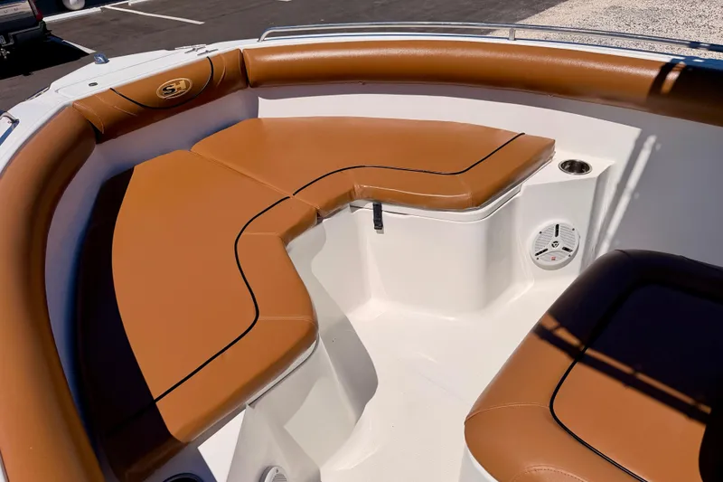 Slide: The Image of Brown cushioned seating on 2010 Sea Hunt Ultra 210 boat deck. - 8