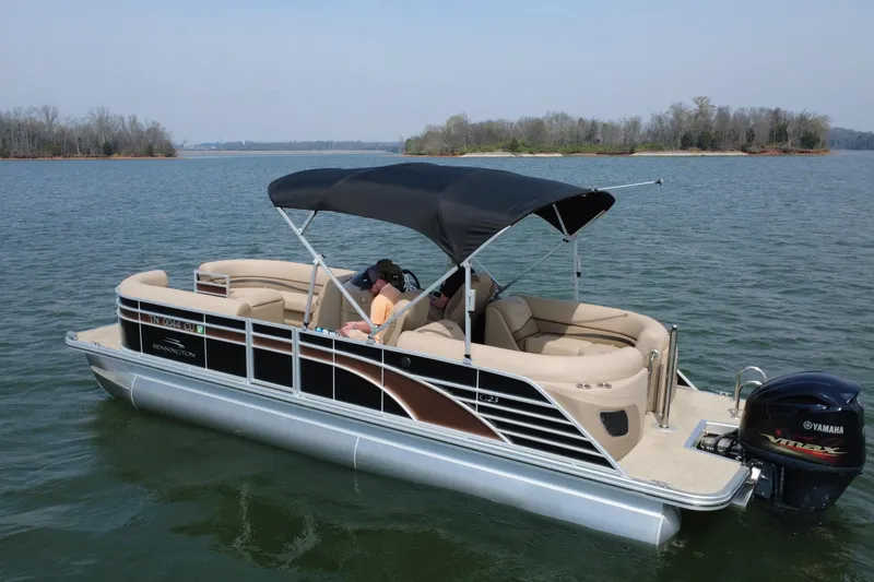 Slide: The Image of 2018 Bennington 23GSRFB pontoon boat on a lake with Yamaha outboard motor. - 9