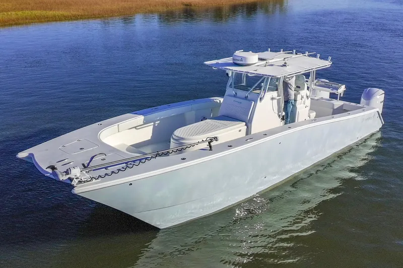 The Image of Freeman 33 boat from 2011 on calm water, showcasing sleek design and spacious deck. - 0