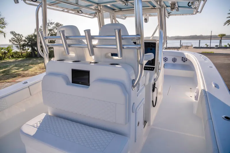 Slide: The Image of Interior view of a 2011 Freeman 33 boat, featuring sleek seating and modern controls. - 12
