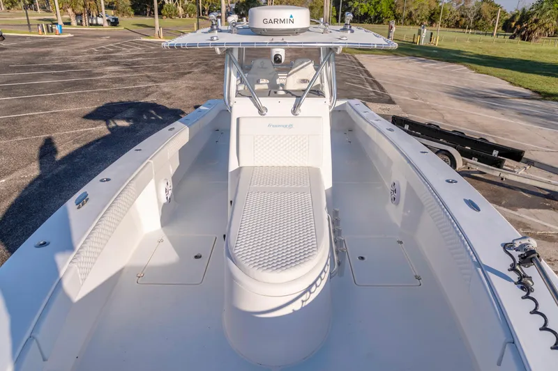 Slide: The Image of 2011 Freeman 33 boat with Garmin equipment, parked on a sunny day. - 15