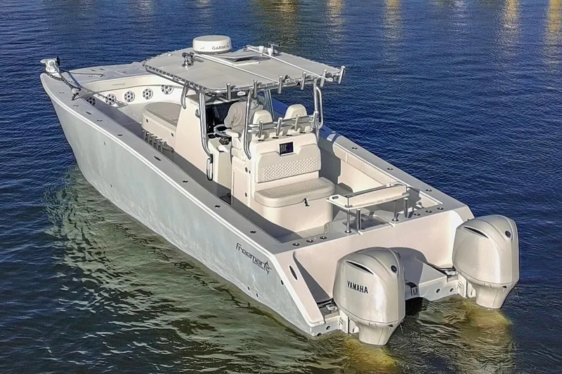 Slide: The Image of Freeman 33 boat, 2011 model, on water with dual Yamaha engines. - 6