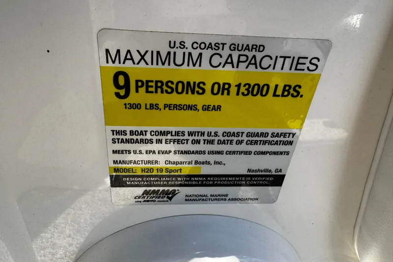 Slide: The Image of 2015 Chaparral 19 H2O Sport capacity label: 9 persons or 1300 lbs, U.S. Coast Guard compliant. - 17