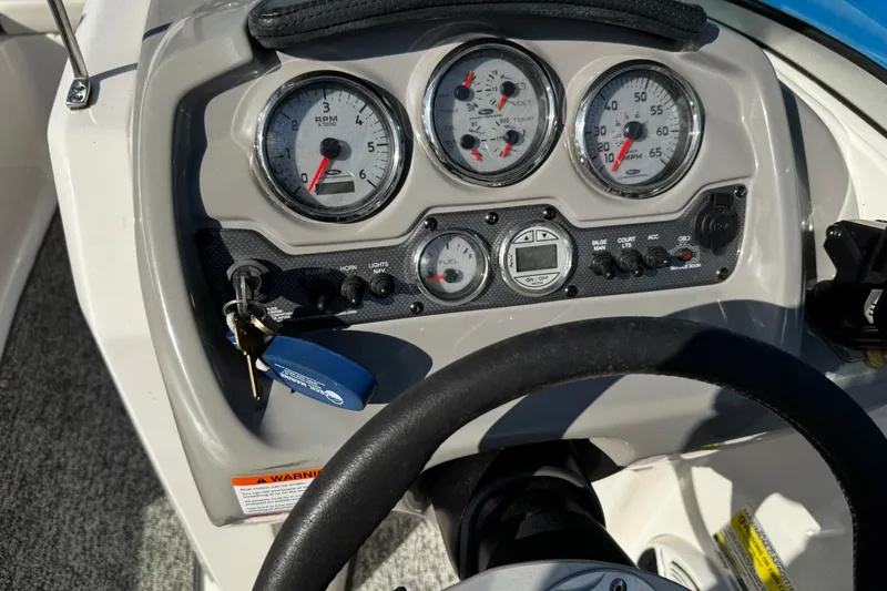 Slide: The Image of Dashboard of a 2015 Chaparral 19 H2O Sport boat with gauges and controls. - 18