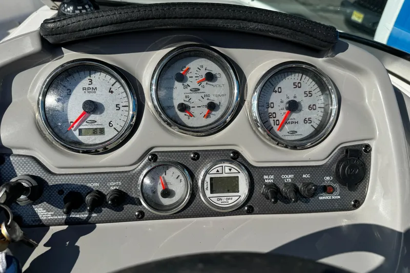 Slide: The Image of Dashboard of a 2015 Chaparral 19 H2O Sport boat with gauges and controls. - 19