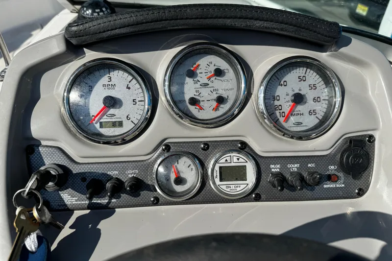 Slide: The Image of Dashboard of a 2015 Chaparral 19 H2O Sport boat with gauges and controls. - 20