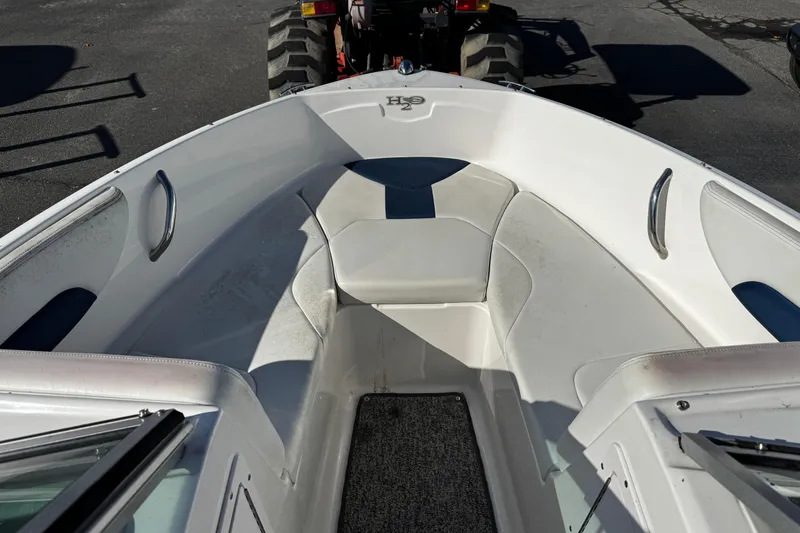 Slide: The Image of 2015 Chaparral 19 H2O Sport boat interior with seating and carpeted floor. - 24