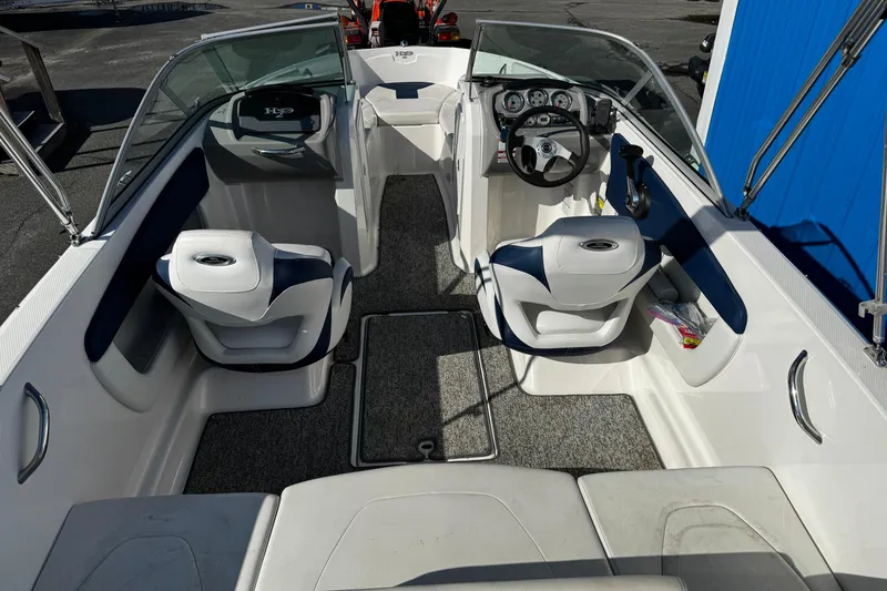 Slide: The Image of 2015 Chaparral 19 H2O Sport boat interior with seating and dashboard. - 25