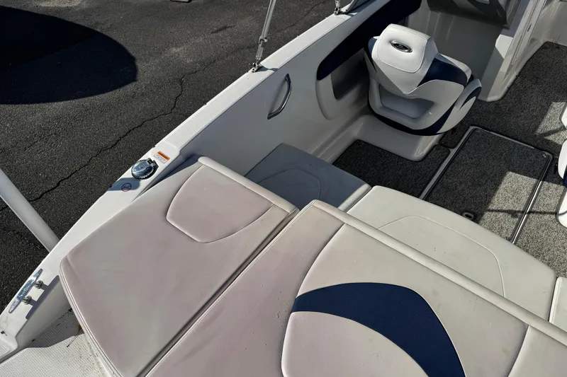 Slide: The Image of 2015 Chaparral 19 H2O Sport boat interior with seating and carpeted flooring. - 26
