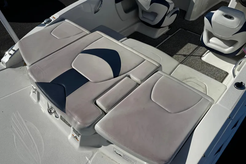 Slide: The Image of 2015 Chaparral 19 H2O Sport boat interior with cushioned seating and modern design. - 27
