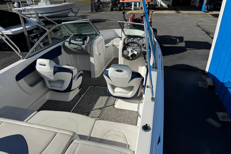 Slide: The Image of 2015 Chaparral 19 H2O Sport boat interior with seating and dashboard view. - 28