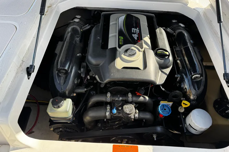 Slide: The Image of Engine compartment of a 2015 Chaparral 19 H2O Sport boat. - 29