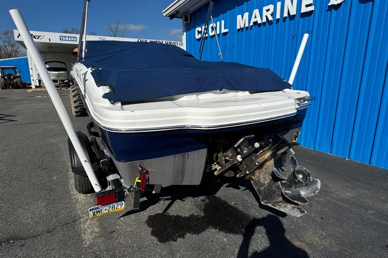 Slide: The Image of 2015 Chaparral 19 H2O Sport boat with cover at marine dealership. - 3