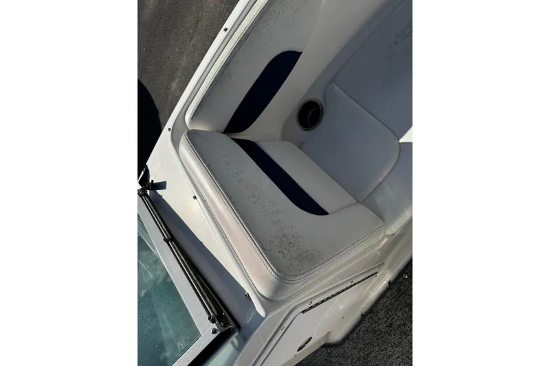 Slide: The Image of 2015 Chaparral 19 H2O Sport boat seat with white and navy upholstery. - 38