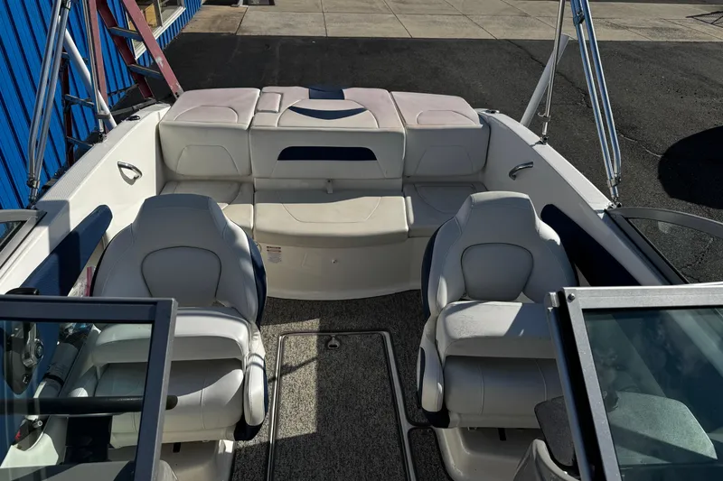 Slide: The Image of 2015 Chaparral 19 H2O Sport boat interior with seating and carpeted floor. - 39