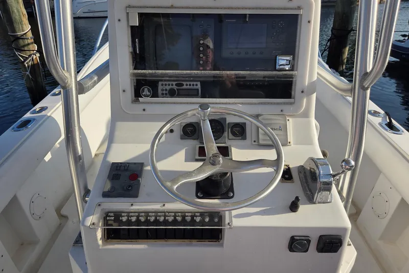 Slide: The Image of Helm of 2000 SeaVee 290B boat with steering wheel and navigation controls. - 15