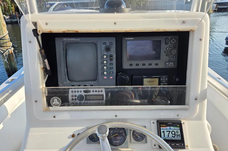 Slide: The Image of Console of a 2000 SeaVee 290B boat with navigation and communication equipment. - 16