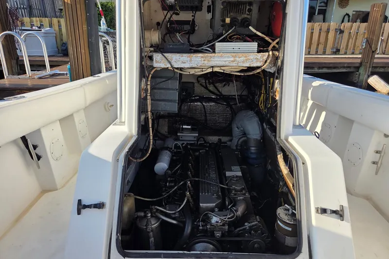 Slide: The Image of Engine compartment of a 2000 SeaVee 290B boat, showing detailed mechanical components. - 18