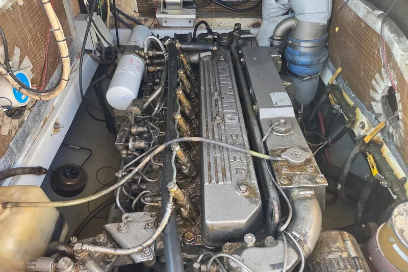 Slide: The Image of Engine compartment of a 2000 SeaVee 290B boat, featuring a Yanmar diesel engine. - 20