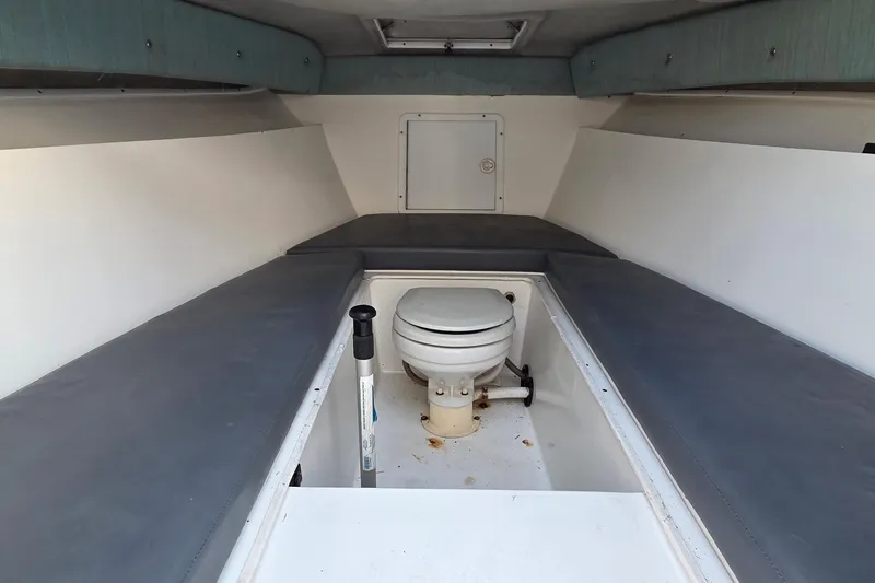 Slide: The Image of Interior cabin of 2000 SeaVee 290B boat with toilet and seating. - 27