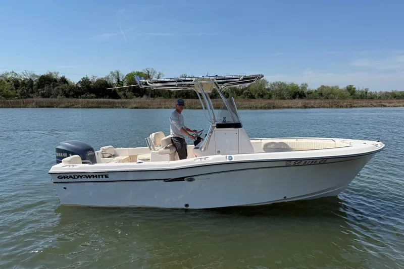 The Image of 2011 Grady-White Fisherman 209 boat on calm water, featuring a Yamaha engine. - 0