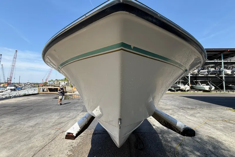 Slide: The Image of 2011 Grady-White Fisherman 209 boat on trailer at marina, clear sky background. - 10