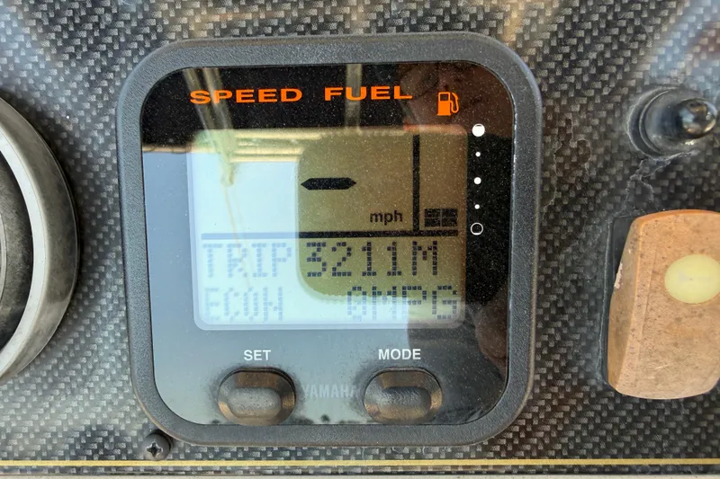 Slide: The Image of Dashboard display of a 2011 Grady-White Fisherman 209 boat showing trip mileage. - 19