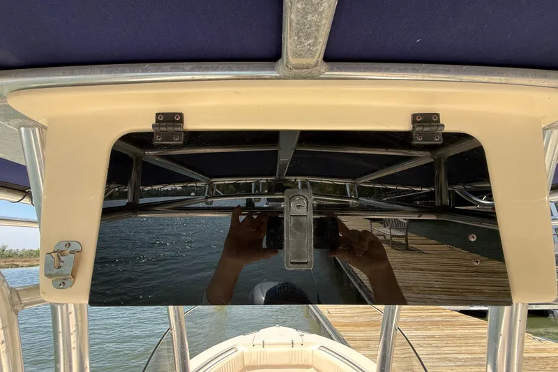 Slide: The Image of 2011 Grady-White Fisherman 209 boat console with reflective panel and water view. - 21
