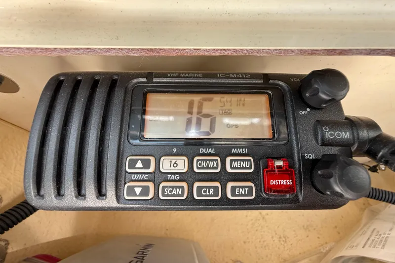 Slide: The Image of VHF marine radio on 2011 Grady-White Fisherman 209 boat, displaying channel 16. - 22